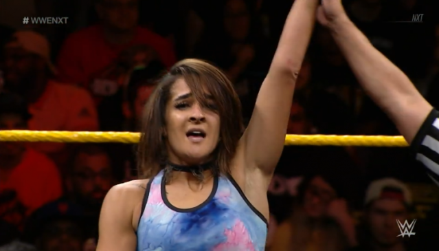 Dakota Kai stands, with her arm raised, after defeating Taynara Conti on Nov. 7 nXt show.