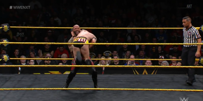 Ricochet is in the middle of a northern lights suplex on Adam Cole, February 13, on nXt.