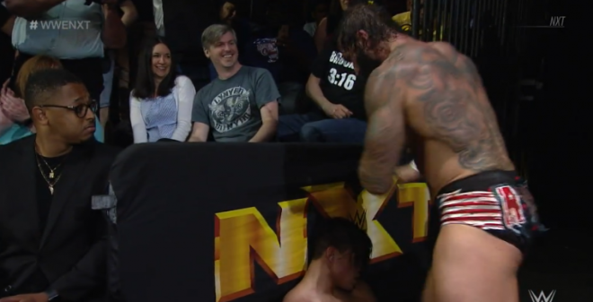 Ryker knees Carrillo in the face by a side barricade in the audience at Full Sail, April 24 nXt