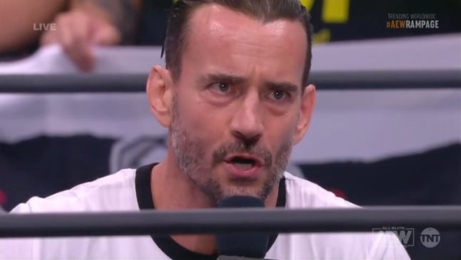 A closeup of CM Punk's face as he is seated in the ring delivering his return address, after joining AEW. His first promo in 7 years.