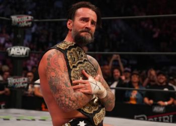 CM Punk with the AEW World Title after Double Or Nothing.